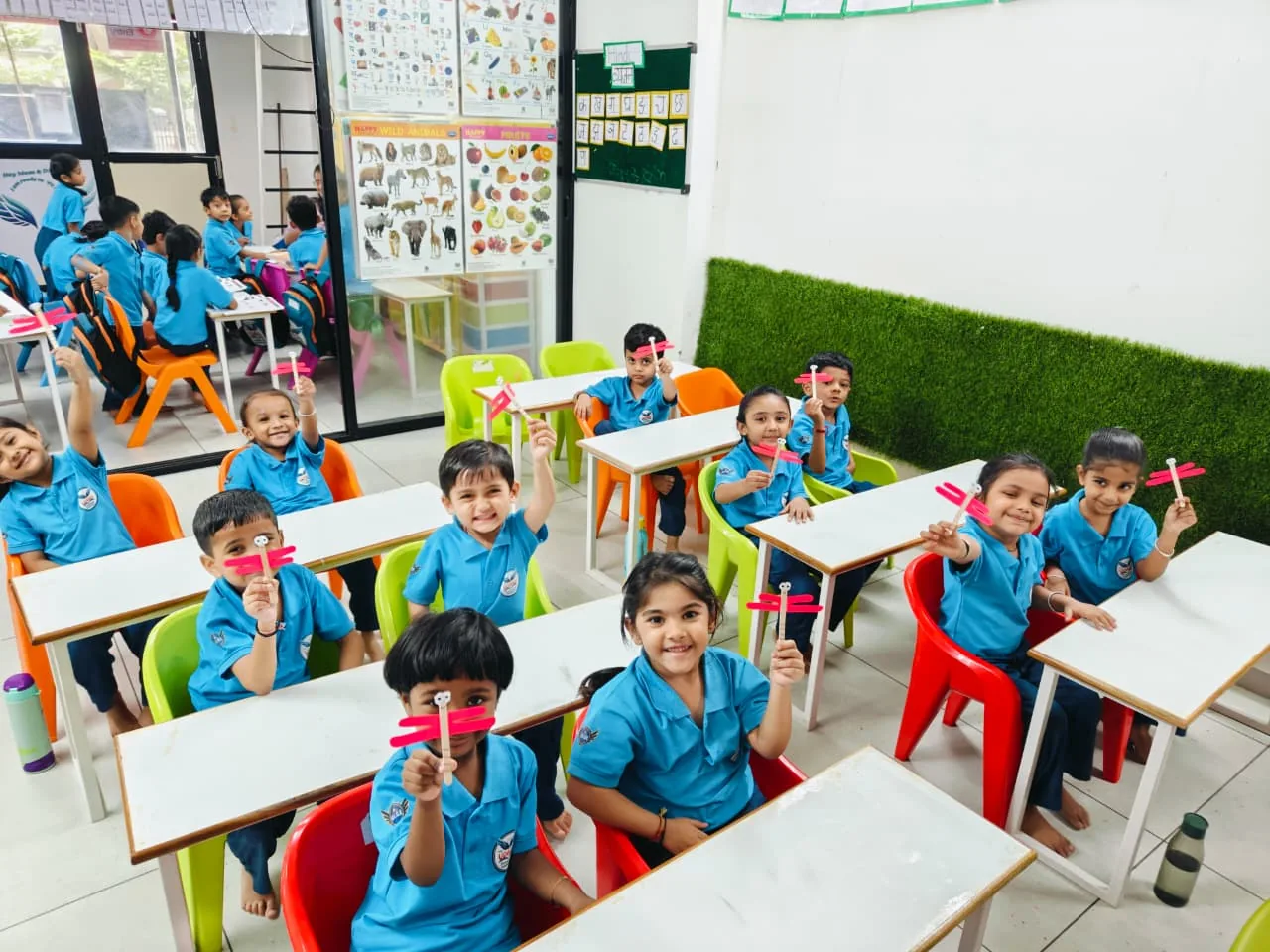 Children enjoying a hands-on classroom activity at The Udaan Preschool