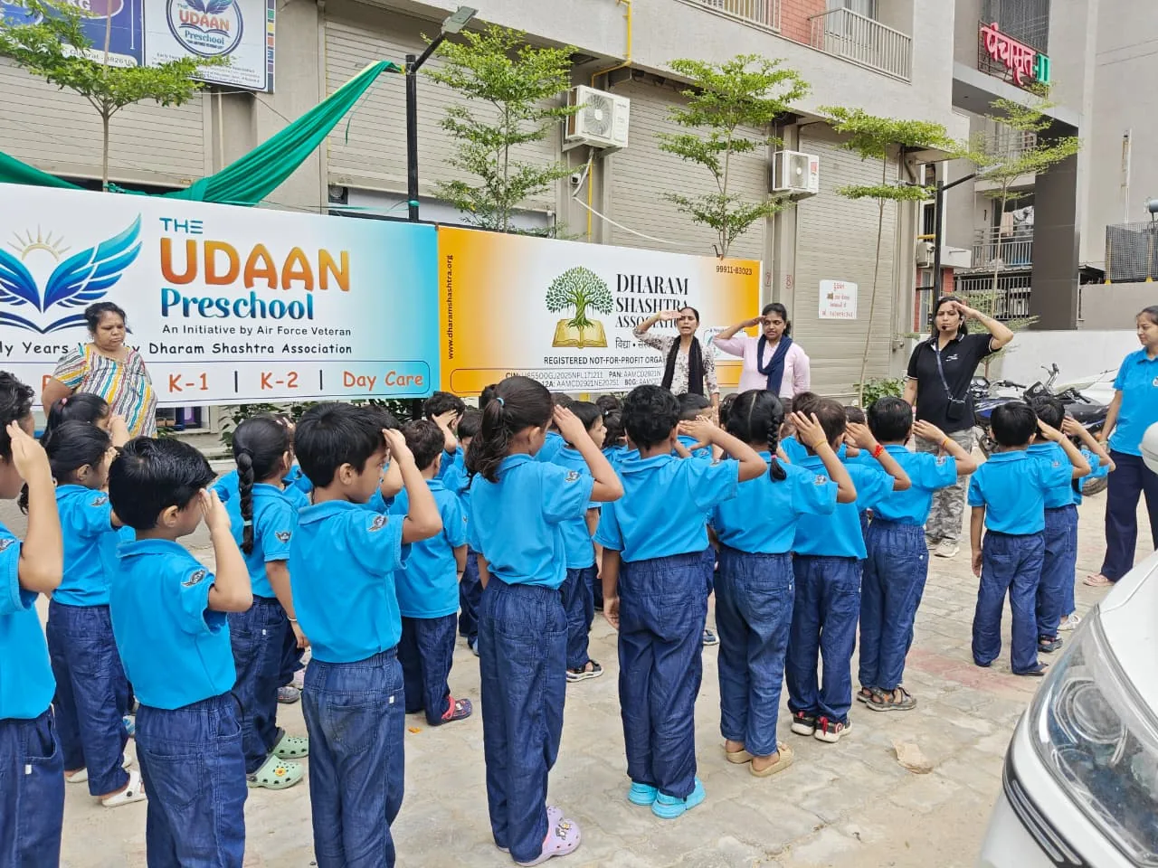 Udaan students and teachers taking part in a school assembly